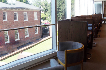 A window with natural light and study carrels for quiet, individual study in the Art Library second floor