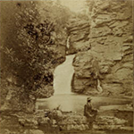 man sitting in front of Linville Falls