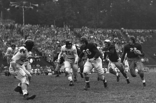 UNC football players in action on the field