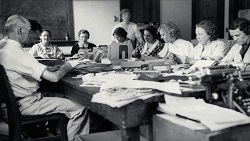 Black and white photograph of Archives staff at work