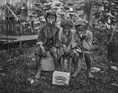 Children smoking Carolina Brights. New Bern, NC, ca. 1912.