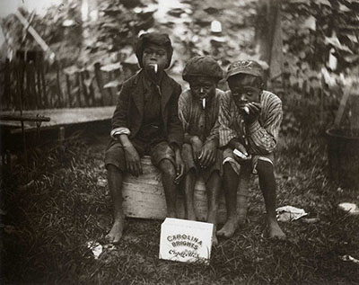 Children smoking Carolina Brights. New Bern, NC, ca. 1912.