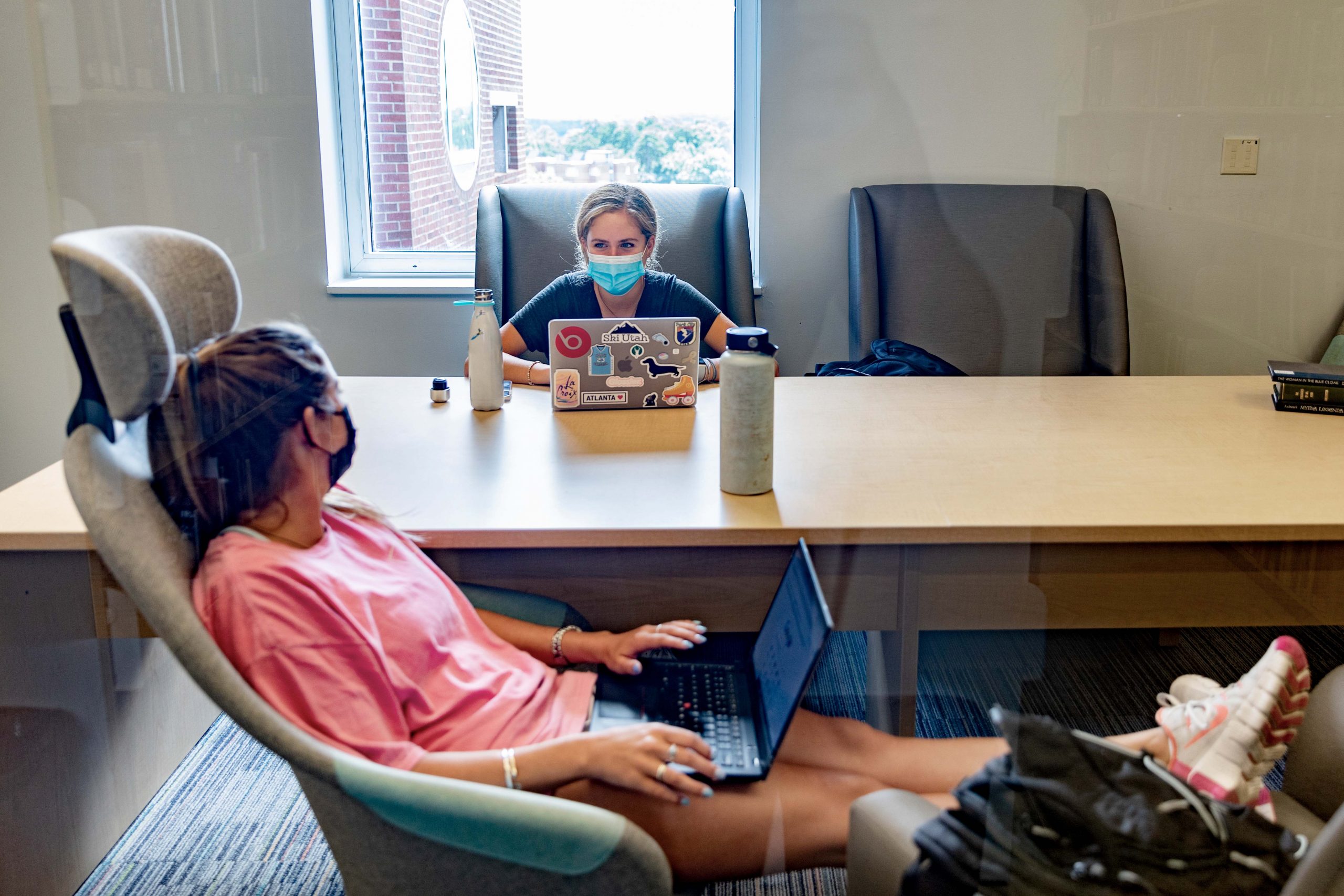two students work in a study room in Davis Library