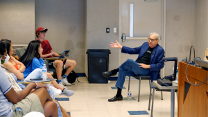 Lewis Black speaks to a classroom of students at UNC