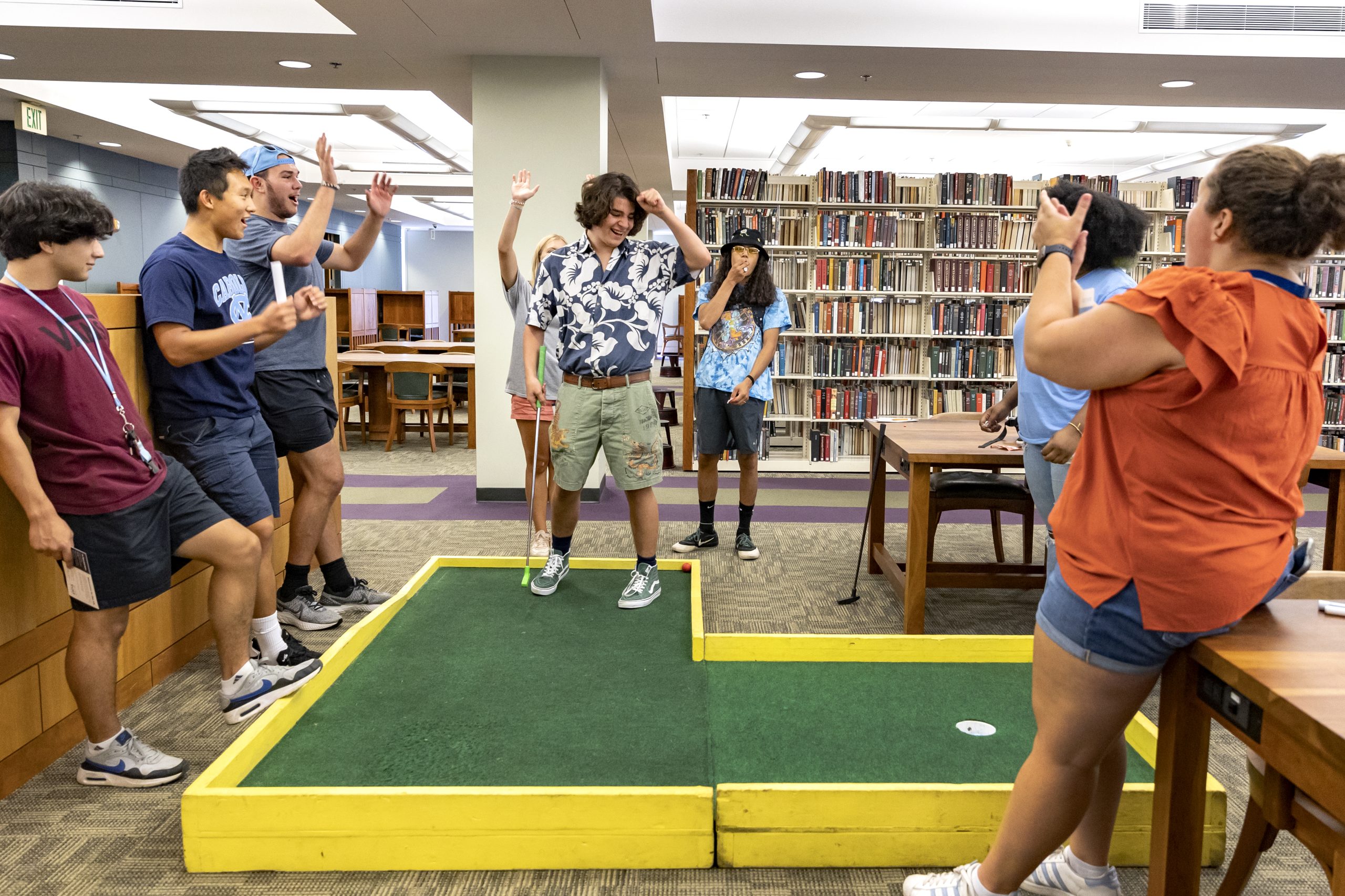 students playing mini golf in the undergraduate library
