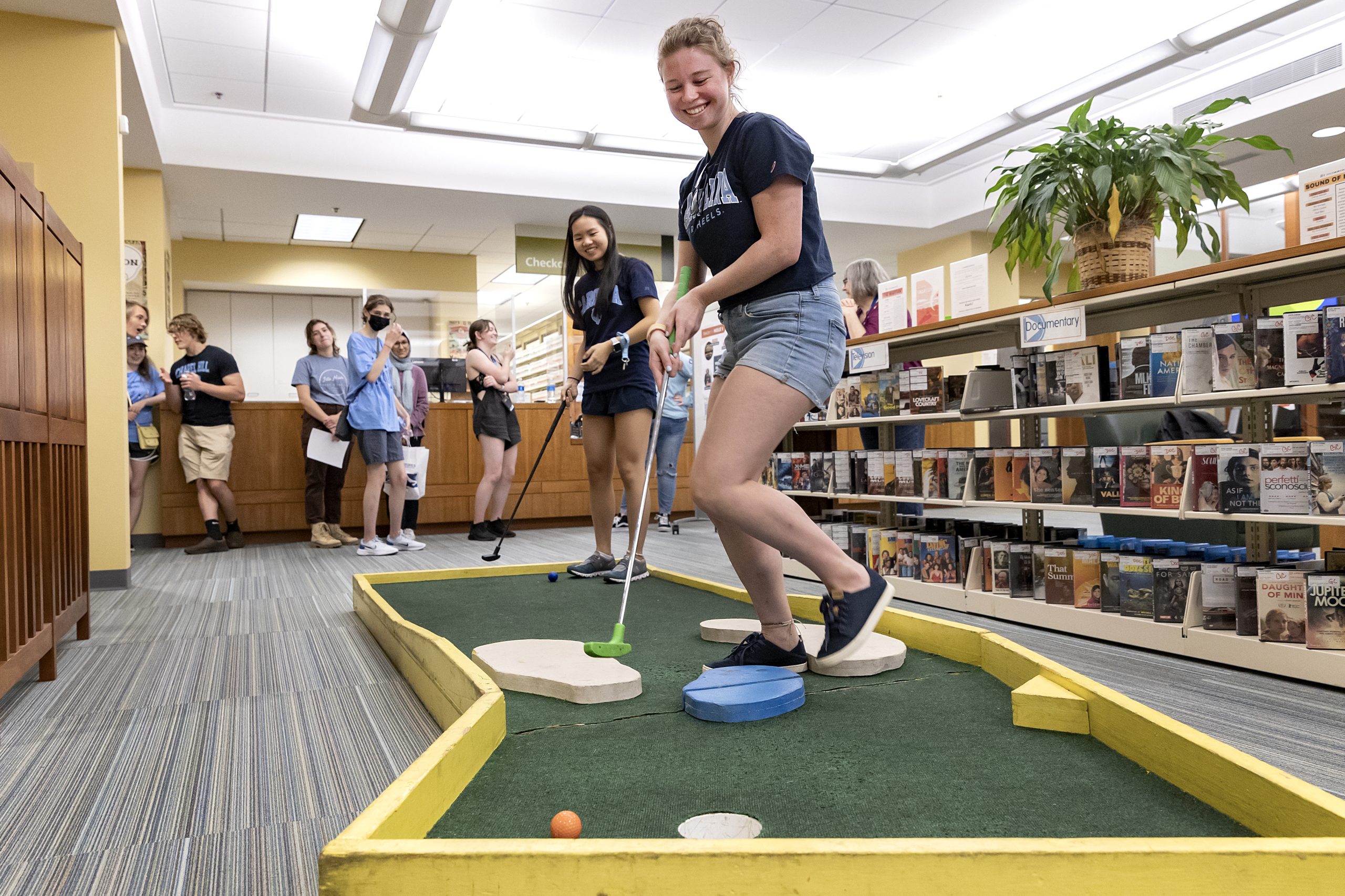students playing mini golf in the undergraduate library