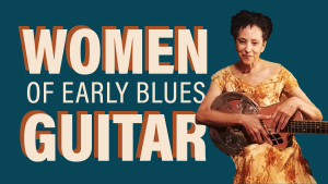 Women of Early Blues. Valerie Turner holds a guitar.