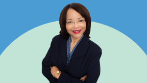 Portrait of Maxine Brown-Davis on a mint and Carolina blue background