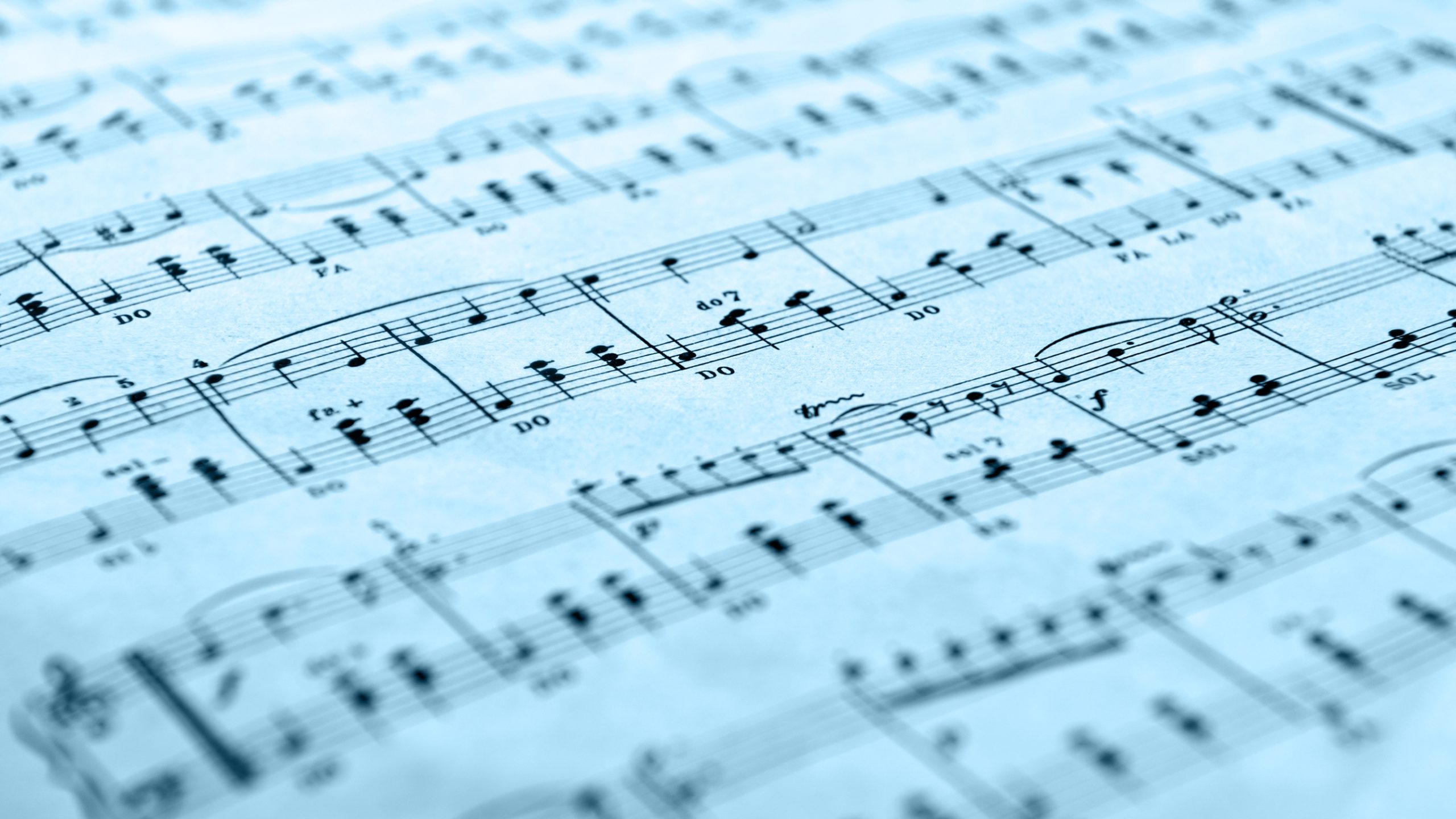 Photo of sheet music with a blue tint