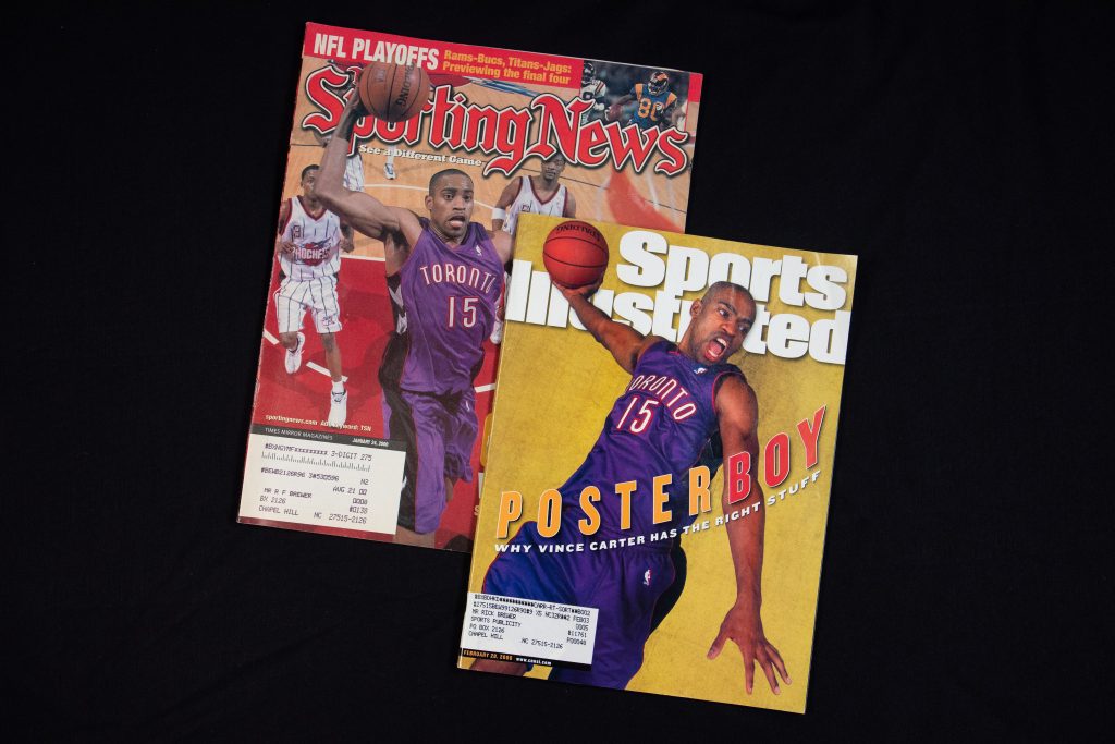 Covers of 2 color magazines, Sports Illustrated and Sporting News, showing a young black man jumping up with a basketball.