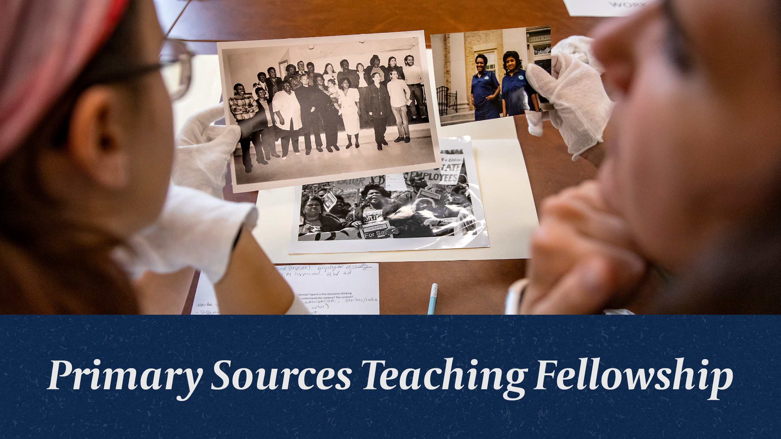 Primary Sources Teaching Fellowship. Photograph of two young white women wearing gloves and holding archival photographs from the Wilson Library Special Collections.