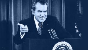 Richard Nixon stands at a podium.
